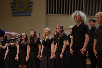 A group of young people singing